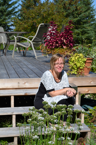 Wendy Southin in her beautiful country garden… after I snapped this photo, as if on cue, a dragonfly came and rested on her hand... it was like something right out of fairy tale!  