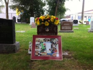 “I sprinkled grass seed and placed sunflowers at Mom's grave. I drank a coffee and remembered mom with the help of my collage. It started to rain, so I am on my way. Next visit there will be more grass and I'll bring some low growing grassy perennials for the base of Moms head stone.” (Ruth Ann McClure, August 2012)