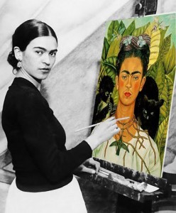 Frida Kahlo painting a self-portrait