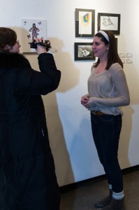 Liana Voia (left) interviewing Kaelan Ryan about her piece "Butterfly Emerging", "Inner Beauty" Opening, February 2013