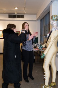 Liana Voia (left) & Jenn Foote (right) discussing her piece "Can You See Me Now?", "Inner Beauty" Opening, February 2013