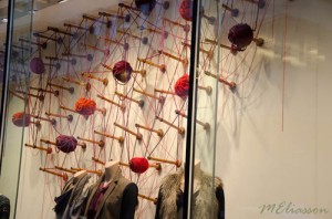 Club Monaco's display of spindles and wool... such a smooth move to showcase the paraphernalia used in the history of fabric/fibre making along with their fashions. (Photo from Meliasson Blog ... see link below)